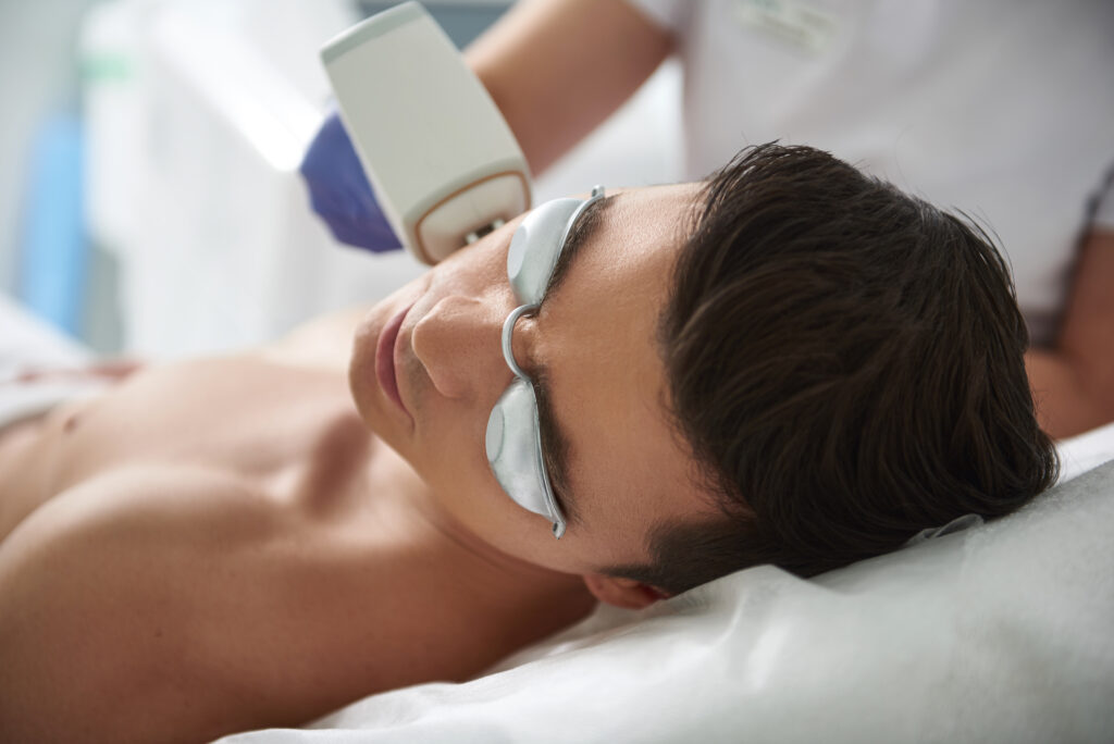Man having Lumecca Intense Pulsed Light (IPL) treatment | Get IPL treatment at Roots Wellness and Medspa in Tampa, Florida