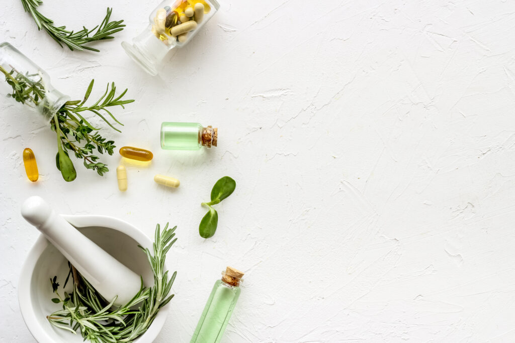 Herbs and medicine on white background | Get Wellness treatment at Roots Wellness and Medspa in Tampa, Florida
